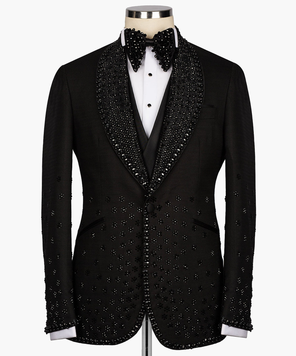 Black tuxedo jacket with jeweled sequin trim, satin lapels, and bow tie detail