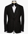 Black tuxedo jacket with jeweled sequin trim, satin lapels, and bow tie detail