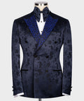 Navy tuxedo jacket with blue stone-embellished lapels, black buttons, bow tie
