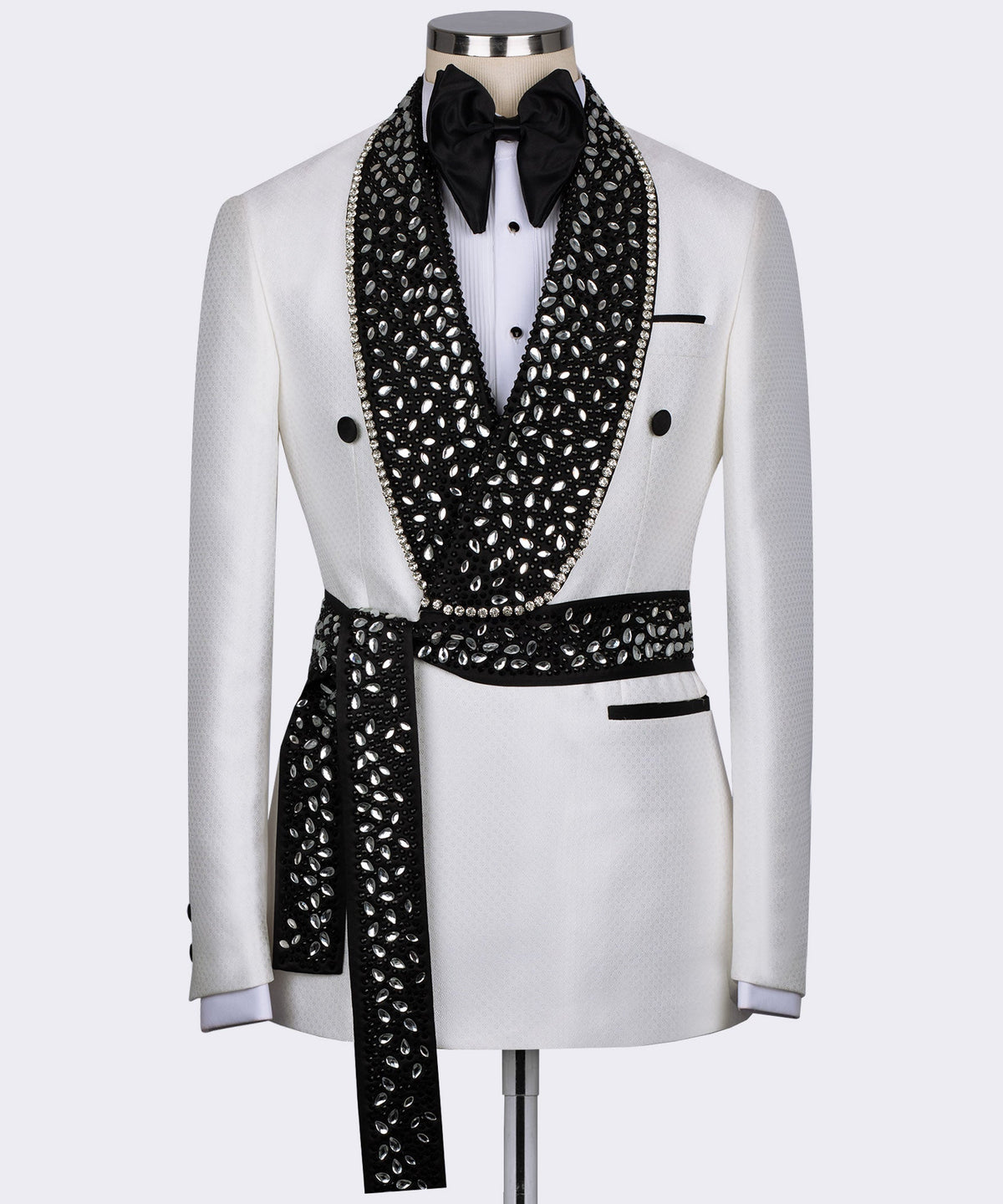 White tuxedo jacket with black jeweled lapels, bow tie, satin trim, and buttons
