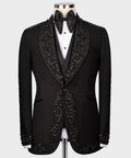 Black tuxedo jacket with jeweled embellishment, satin bow tie and satin lapels