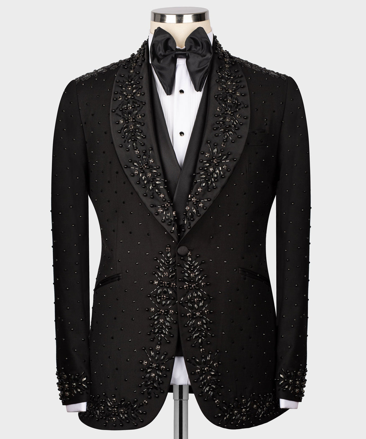 Black tuxedo jacket with satin bow tie, jeweled embellishment on lapels and front