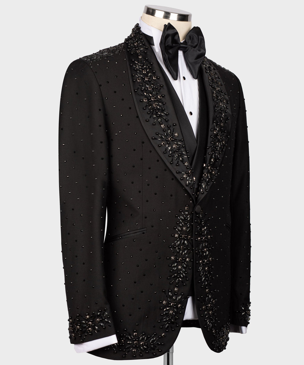 Black tuxedo jacket with deep V lapel and dense beaded embellishments on shoulders