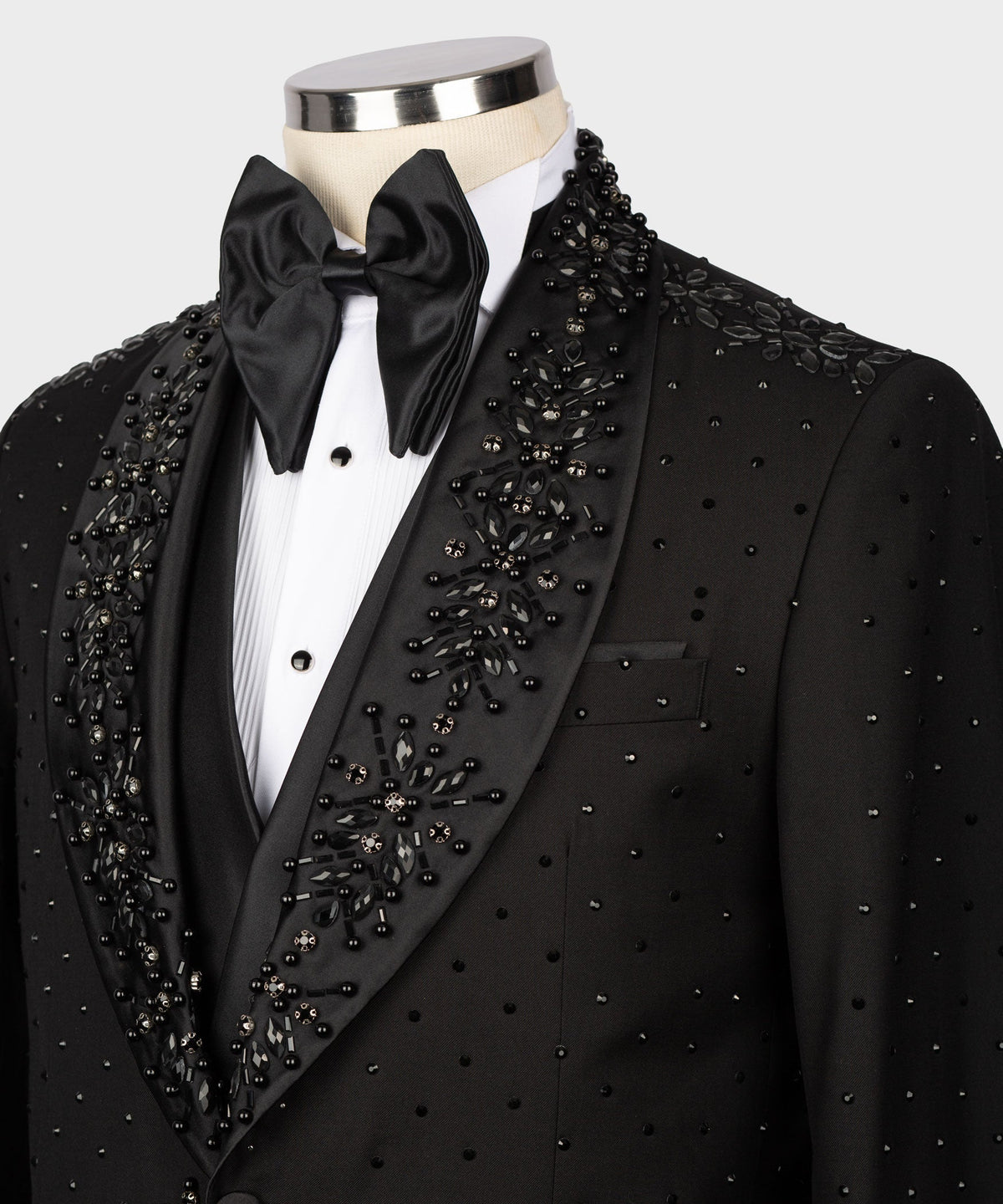 Black tuxedo jacket with satin bow tie and layered beading on lapels and chest