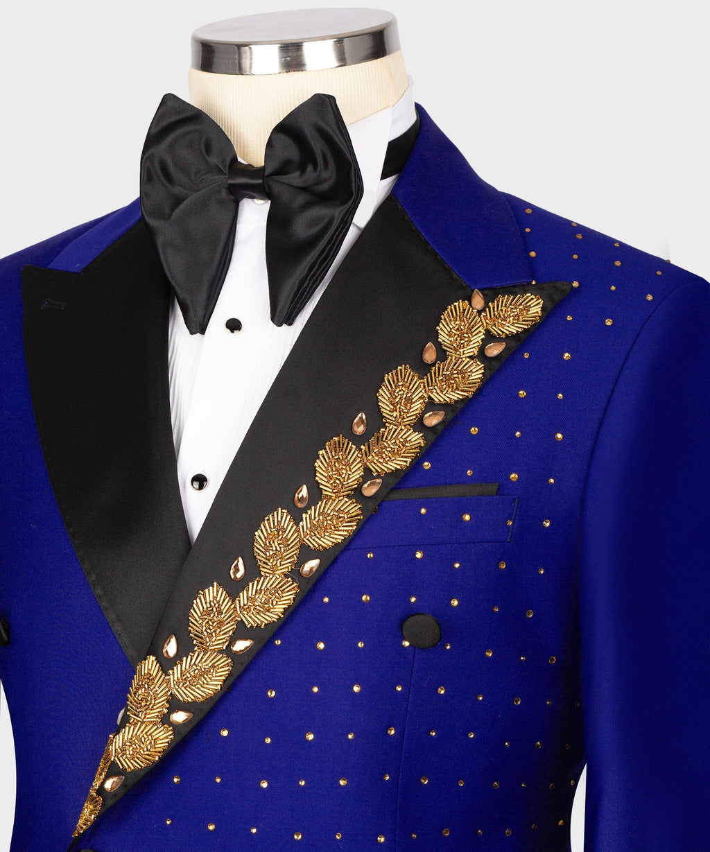 Blue tuxedo jacket close-up with gold embroidered diagonal trim over dotted fabric