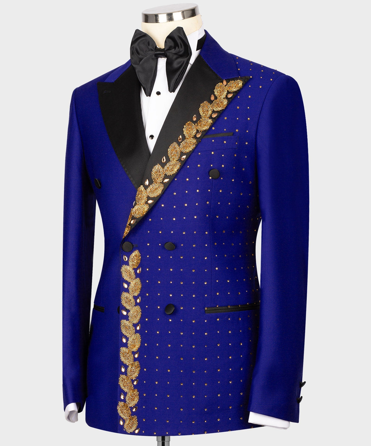 Blue tuxedo jacket front view with gold embroidered diagonal sash and dotted pattern panel