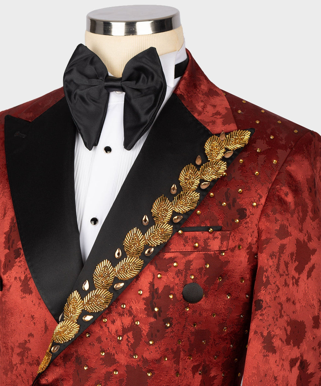 Close-up red tuxedo jacket: black lapel, bow tie, and gold embroidered diagonal trim