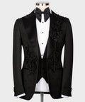 Black tuxedo jacket with satin lapels, floral beaded embellishments, bow tie and vest