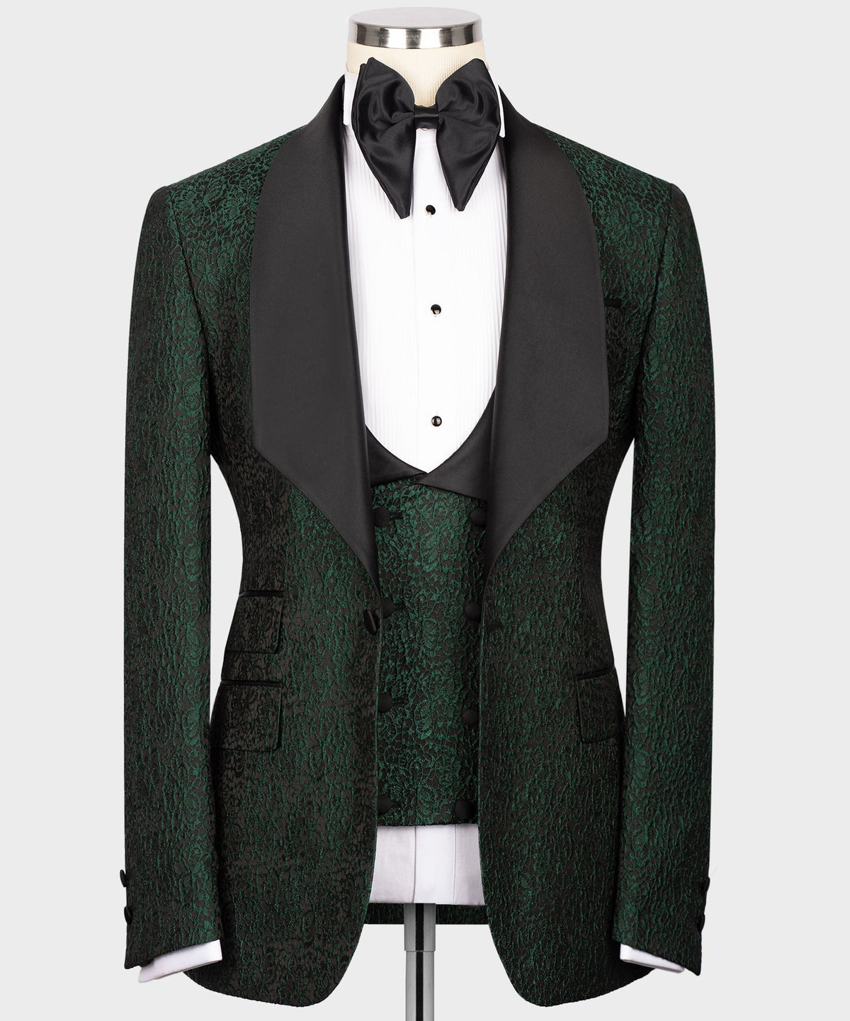 Green embossed tuxedo set with black satin lapels, bow tie, and vest