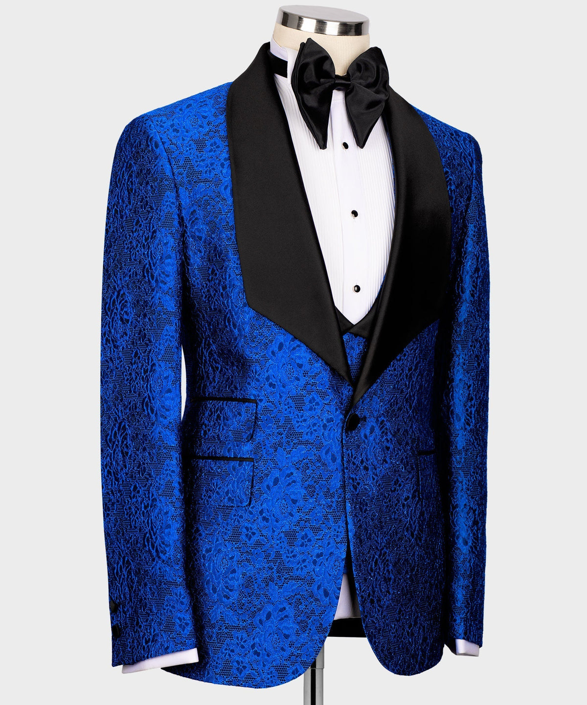 Blue embossed tuxedo jacket with black satin trim and matching vest and trousers