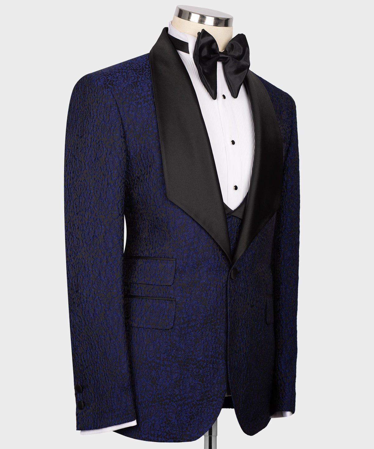 Navy embossed tuxedo jacket side view with black satin lapel and vest