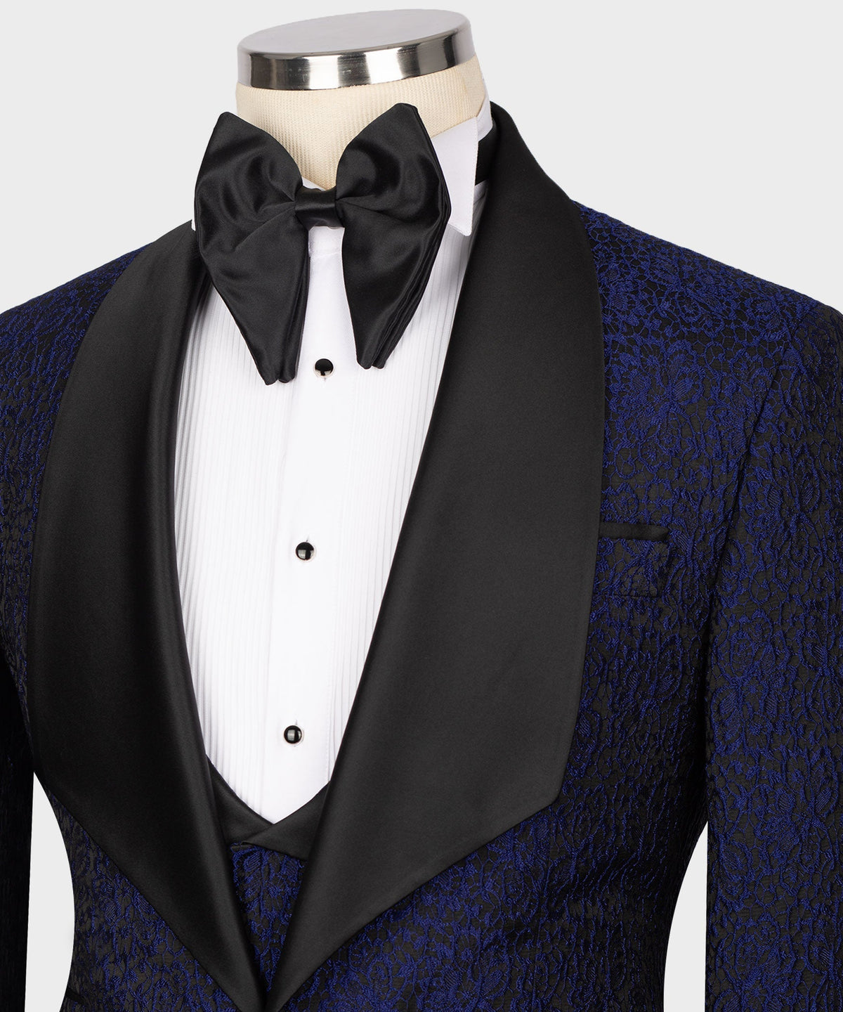 Close-up of navy tuxedo jacket with black satin shawl lapel and white shirt front