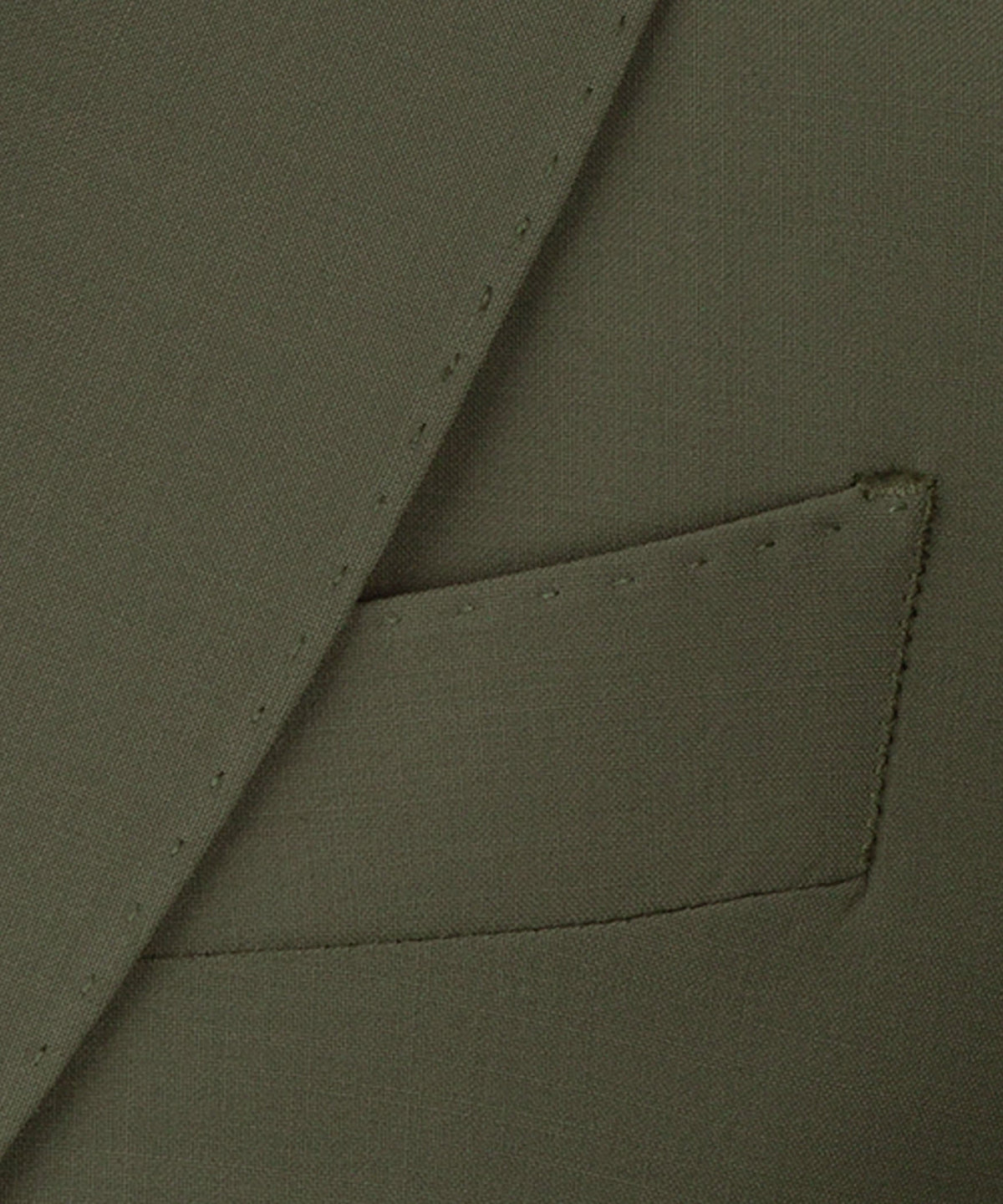 Olive waistcoat fabric close-up showing stitched pocket flap and tailored seam details