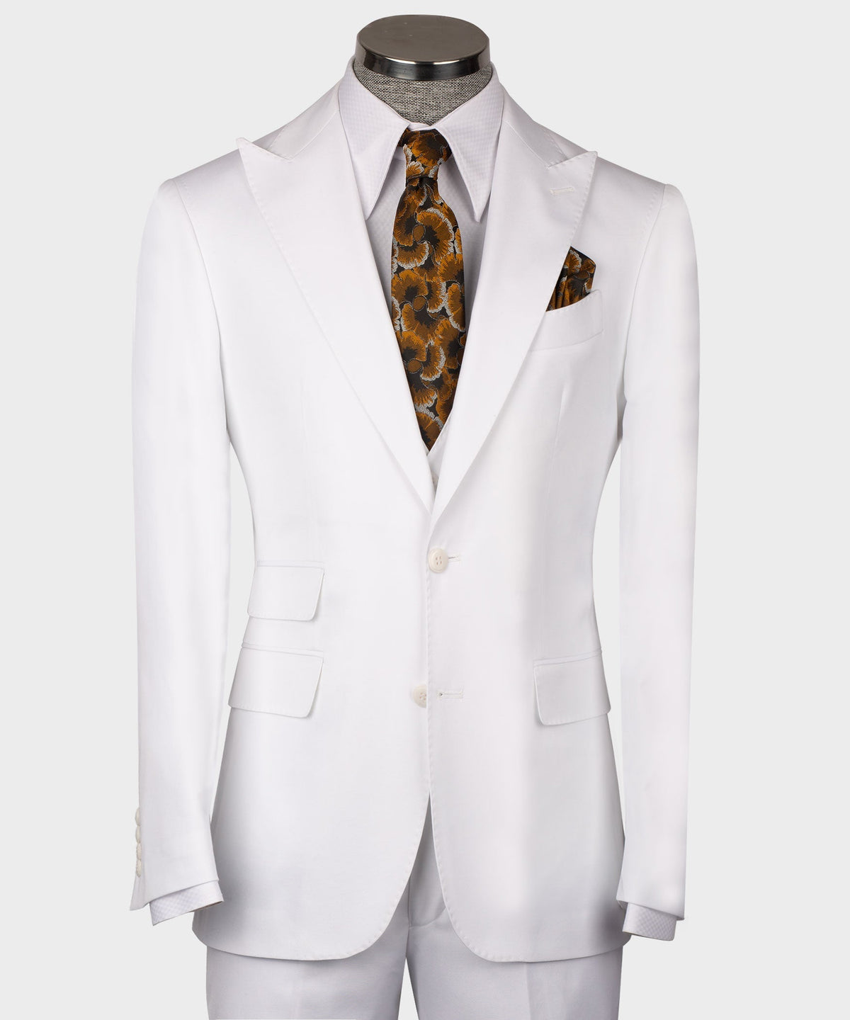 White formal men’s waistcoat on mannequin with button front and welt pockets; patterned tie