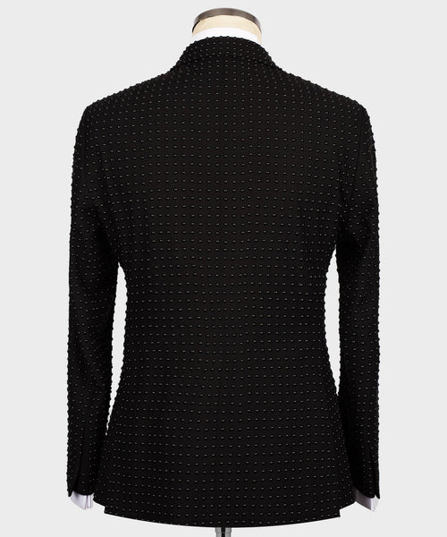 Back view of black tuxedo jacket with all-over stone-embellished pattern