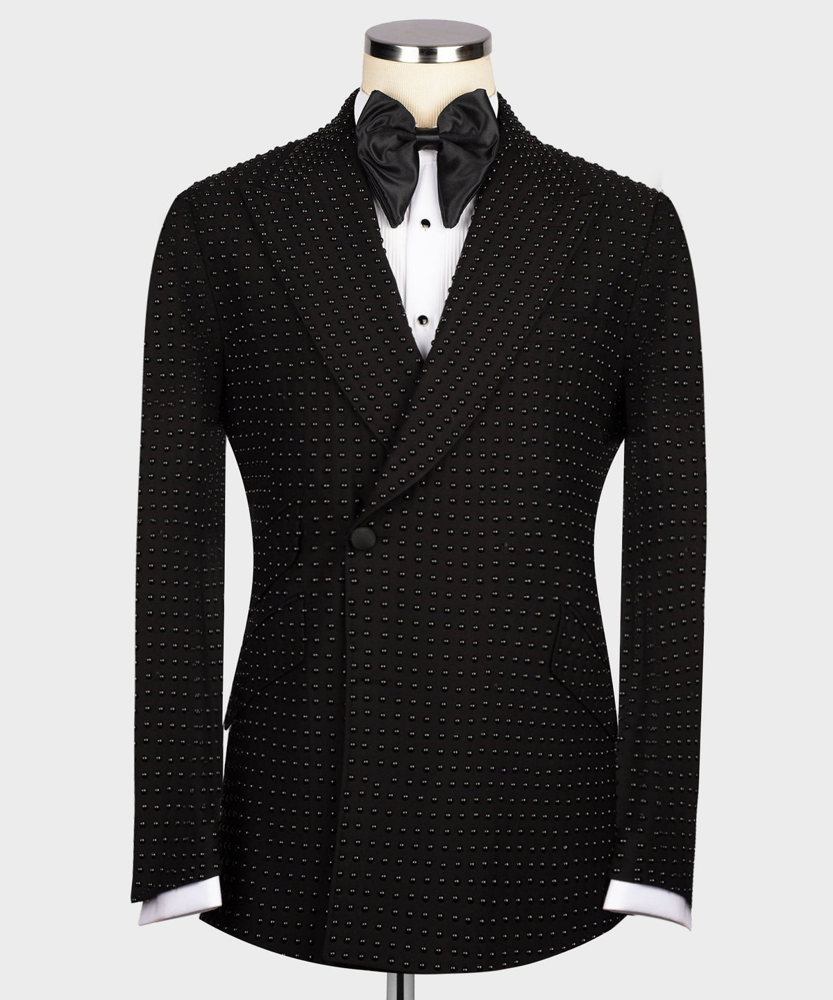 Black tuxedo jacket with stone-embellished dots, satin bow tie, notched lapels