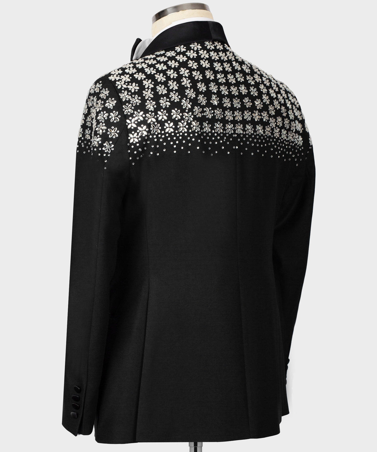 Black tuxedo jacket back with floral stone embroidery across shoulders and upper back