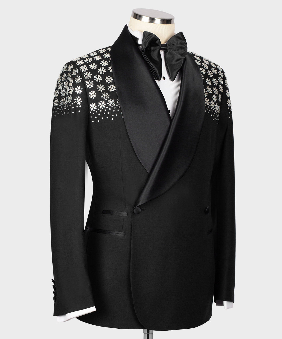 Men's black tuxedo jacket, satin bow tie and embroidered front panel