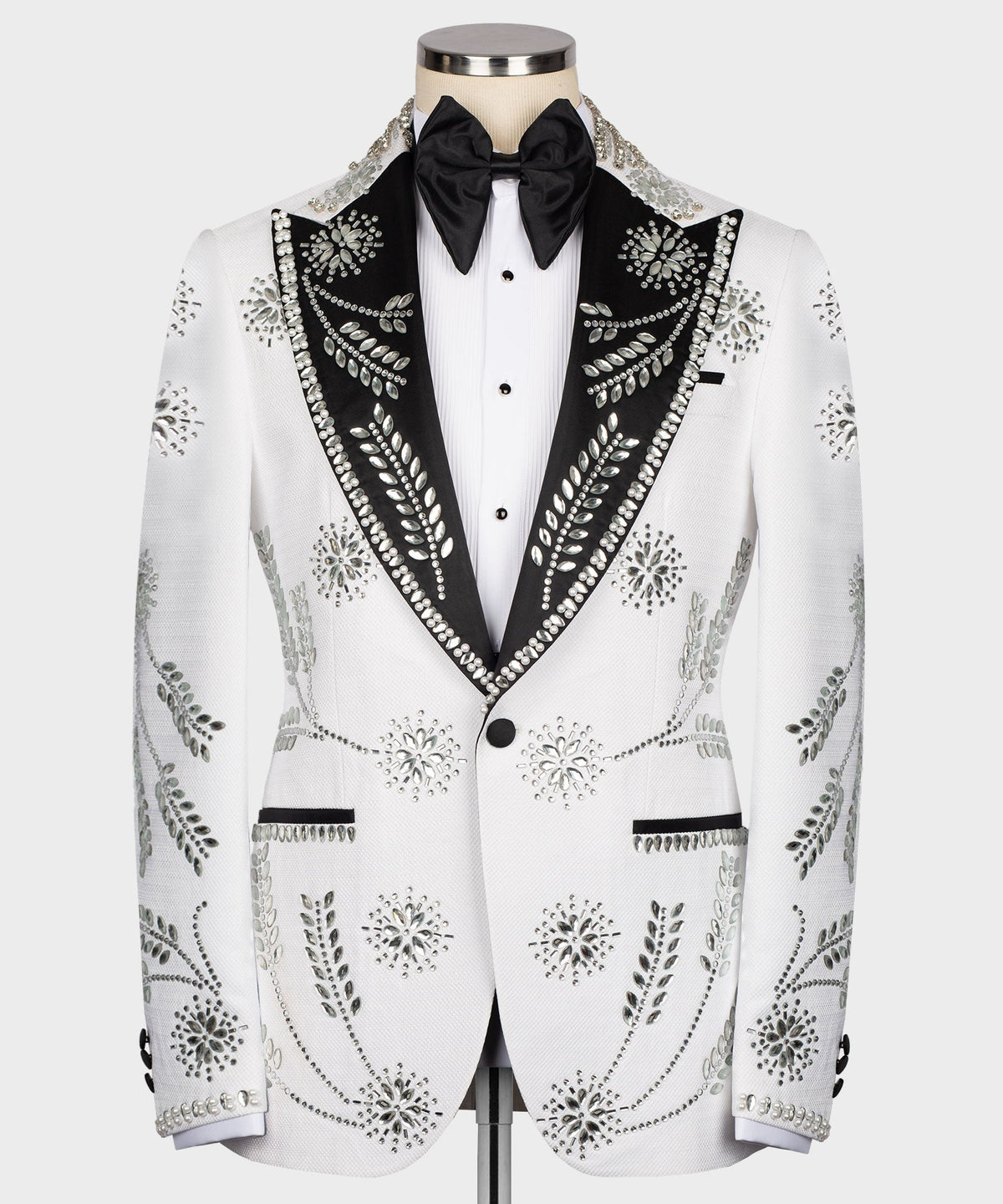 White tuxedo jacket with black satin lapels, bow tie, and rhinestone trim front