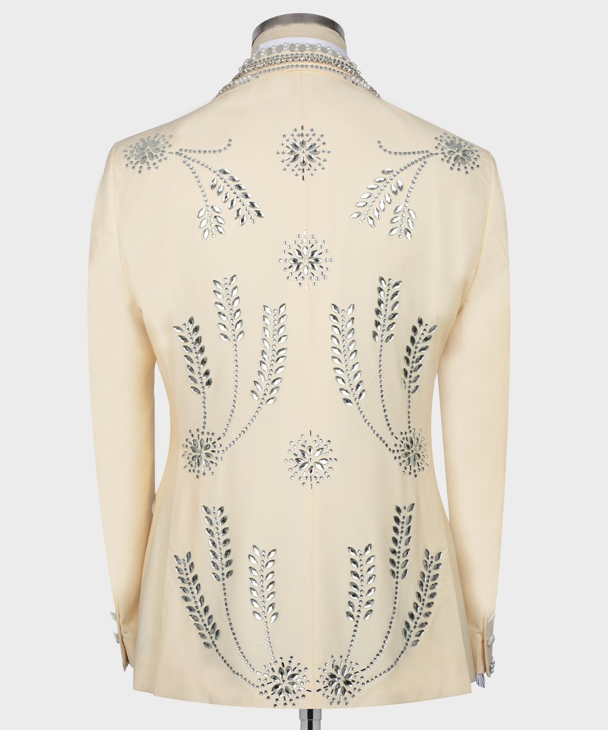 Cream tuxedo jacket back view with gemstone embroidered florals and trailing vine design