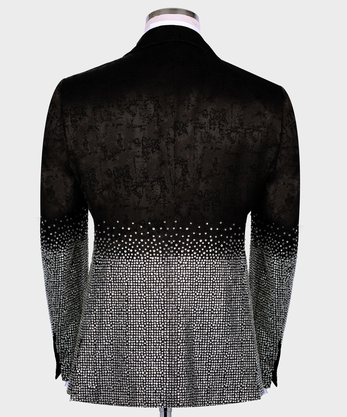 Black tuxedo jacket back view with silver rhinestone detailing at the hem