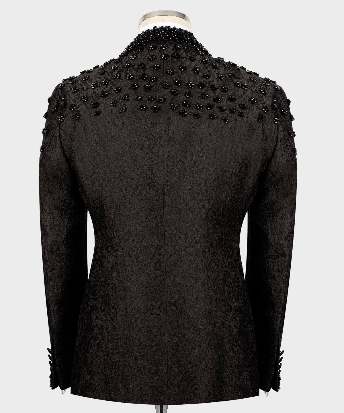 Back view of black tuxedo jacket with allover sequin embroidery, tailored seams