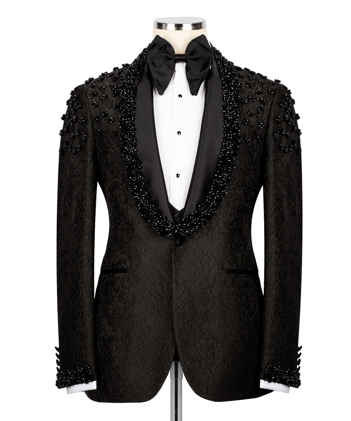 Black tuxedo jacket with beaded sequin embroidery, black bow tie and white vest