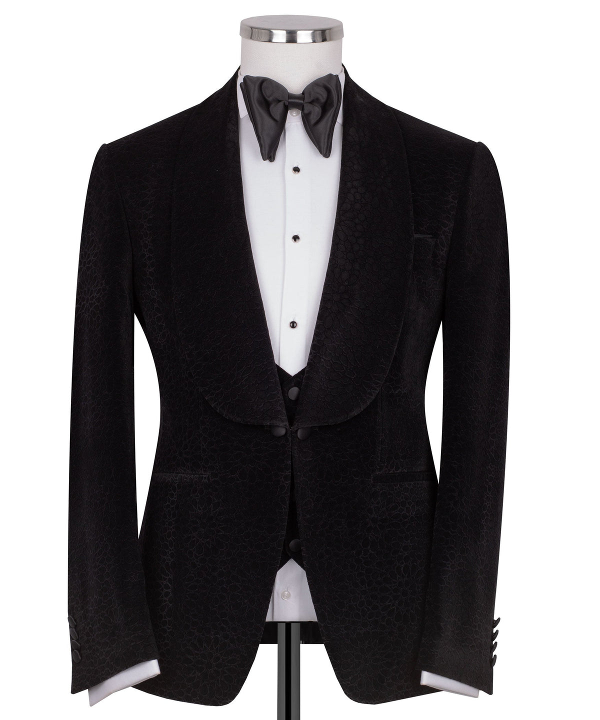 Black velvet tuxedo jacket with shawl lapel and satin bow tie over vest