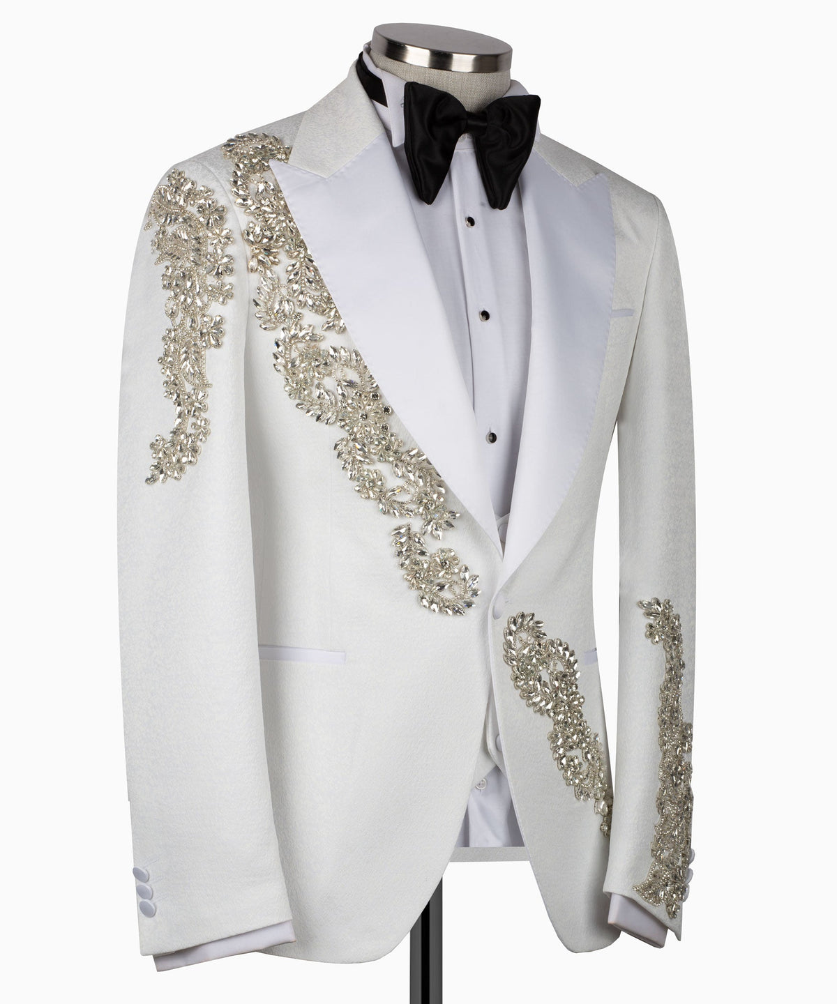 Light gray tuxedo jacket with gold embroidered panels and black bow tie
