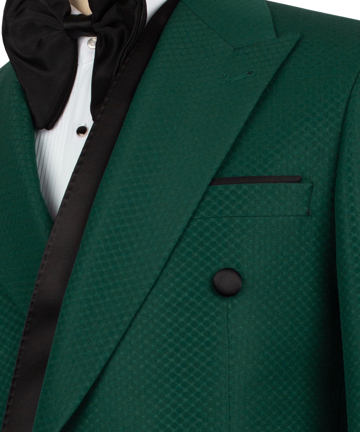 Close-up: green tuxedo lapel and pocket with black trim, textured fabric, button detail