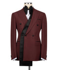 Burgundy long-lapel tuxedo jacket with black bow tie, vest, and satin trim