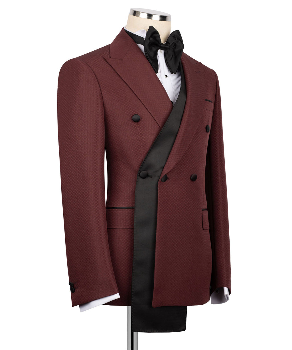 Burgundy tuxedo 3-piece set with peaked lapels, black vest, and bow tie