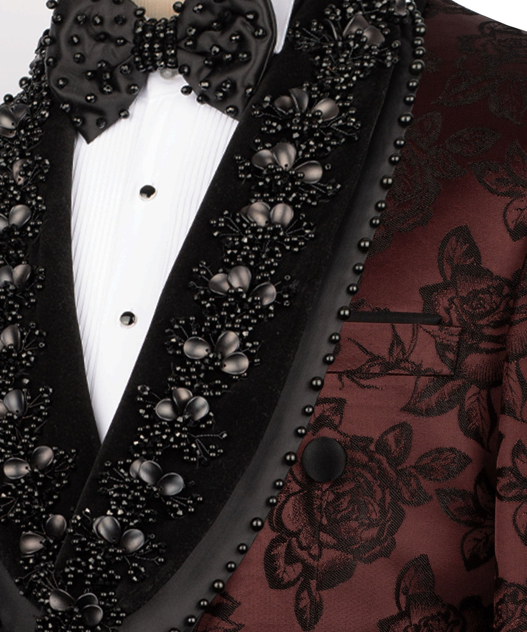 Close-up: black studded lapels with large stones over burgundy floral tuxedo jacket