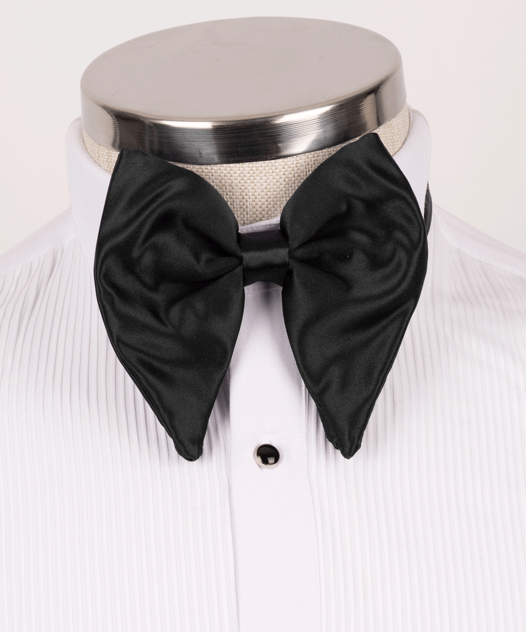 Black satin bow tie on white dress shirt collar