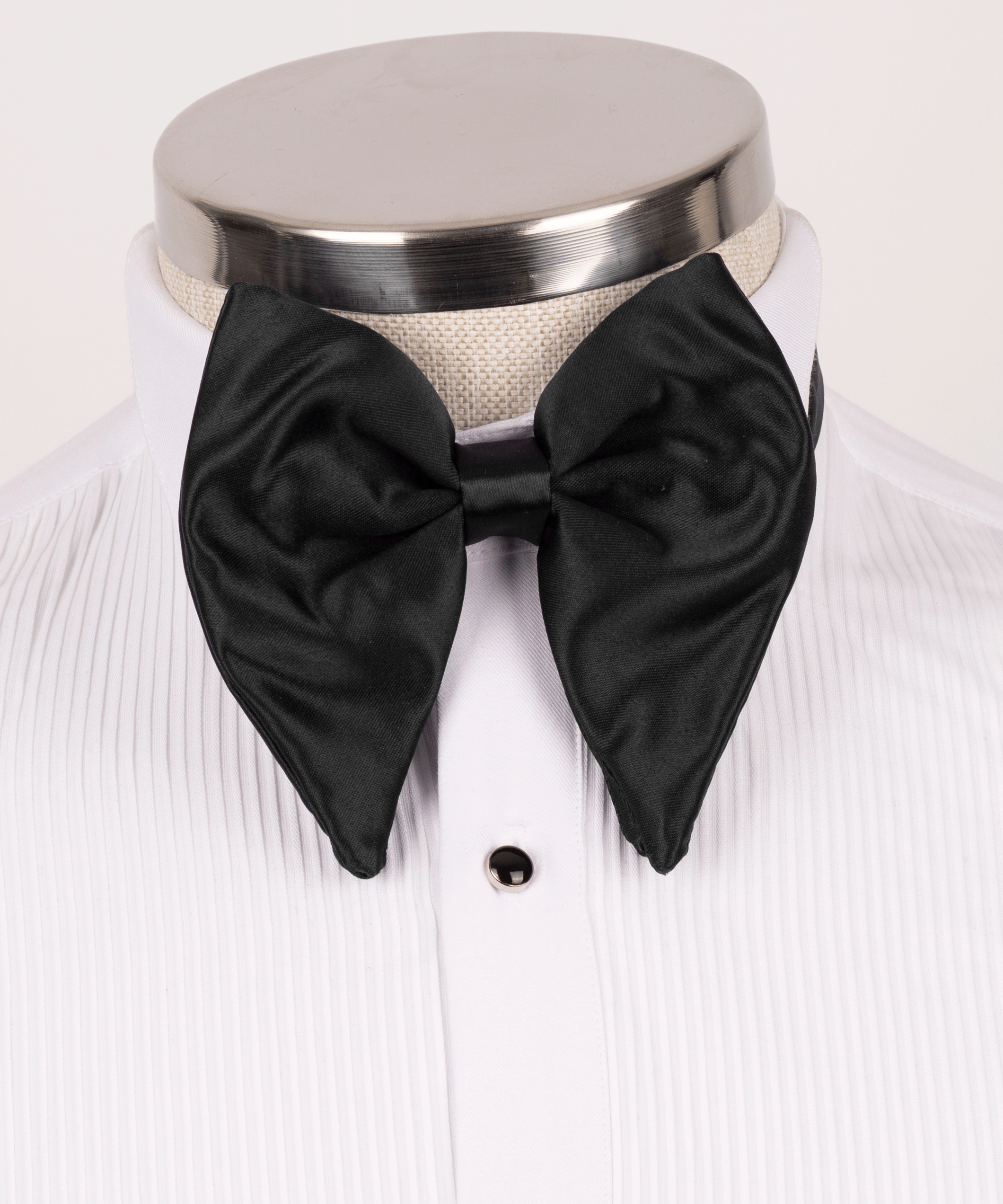 Black satin bow tie on white striped dress shirt with front buttons