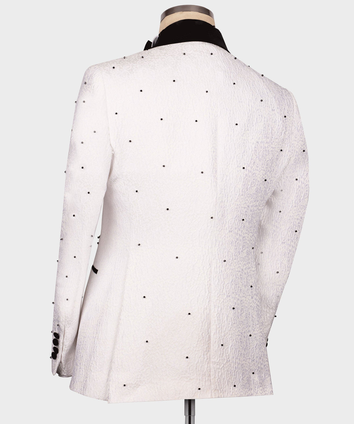 Back view of white tuxedo jacket with small black dot pattern