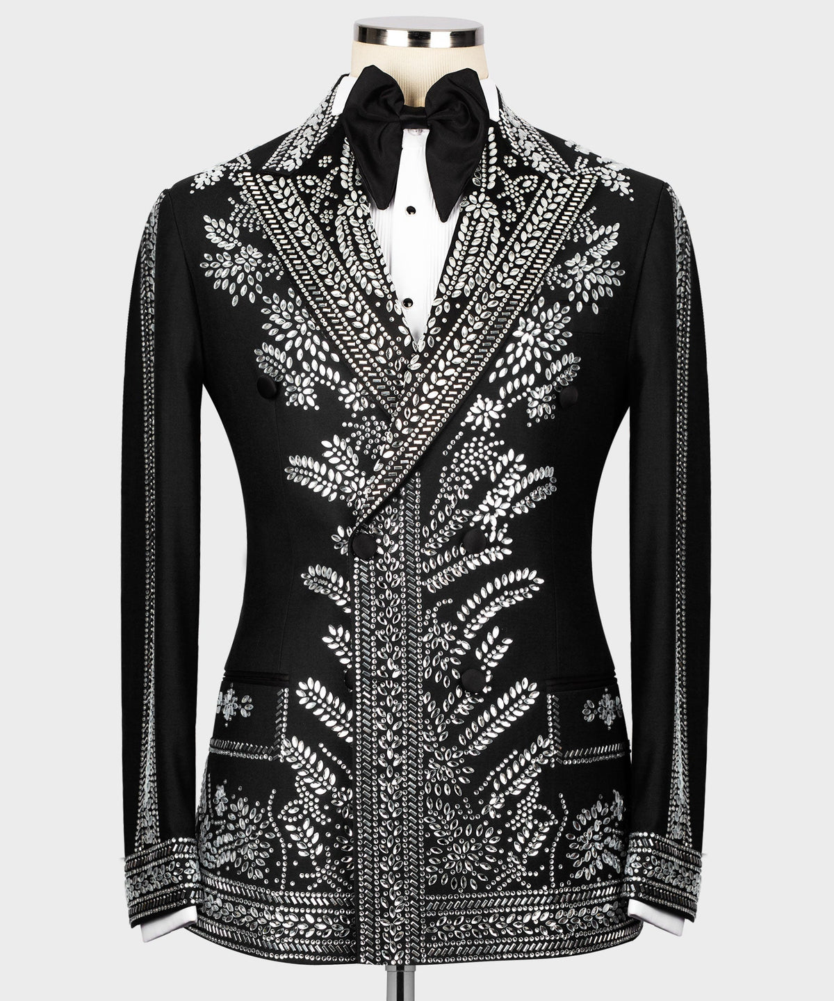 Black tuxedo jacket with silver stone-like embroidery, satin bow tie, peaked lapels