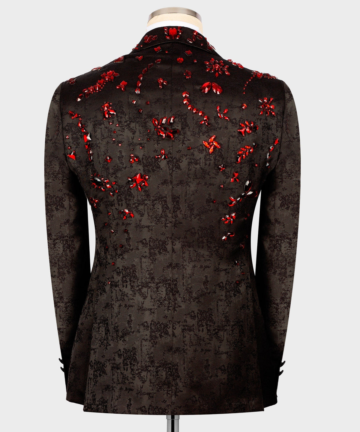 Black tuxedo jacket back view with scattered red stone embroidery across the shoulders