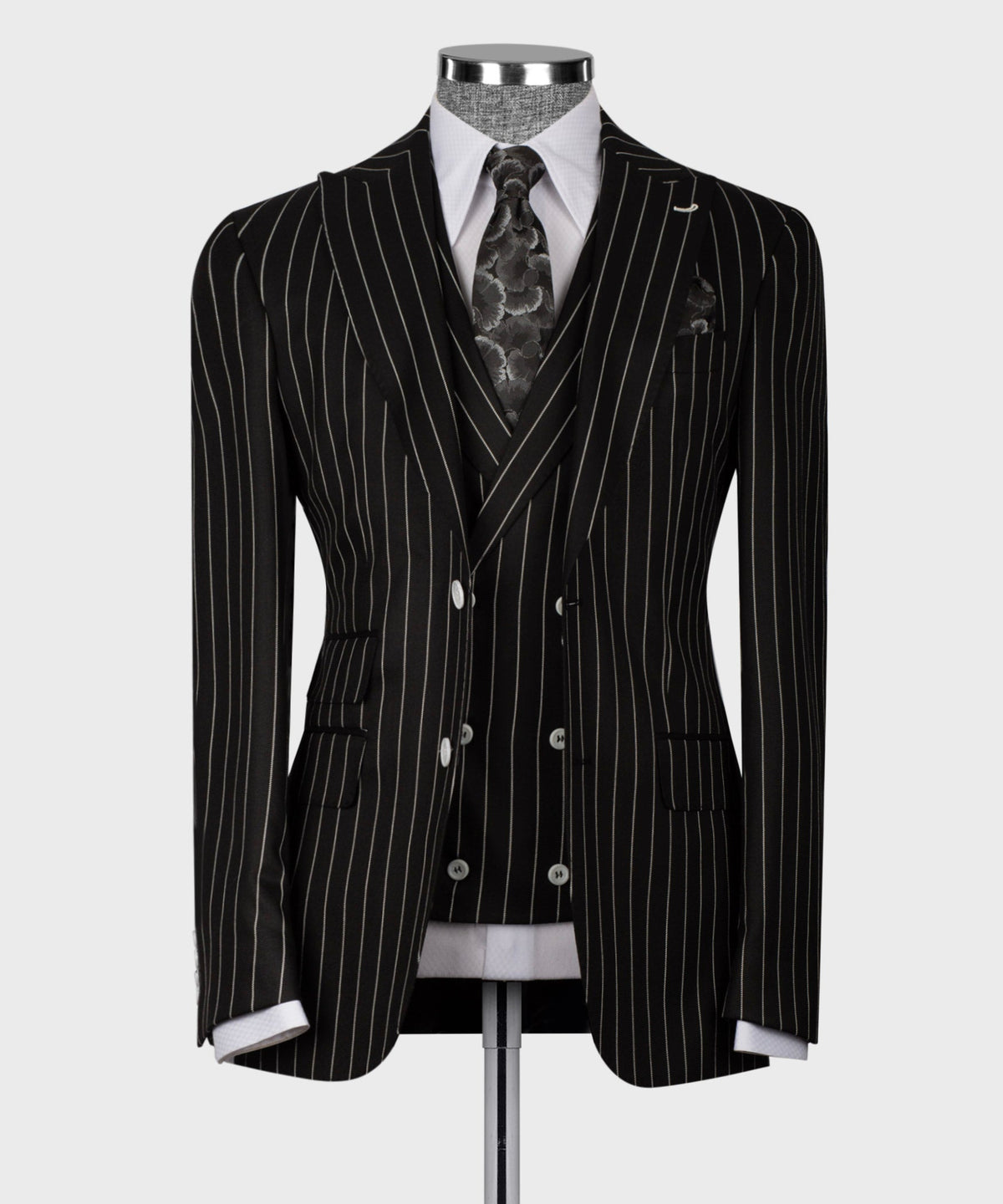 Black pinstriped suit jacket, double-breasted with white dress shirt and patterned tie