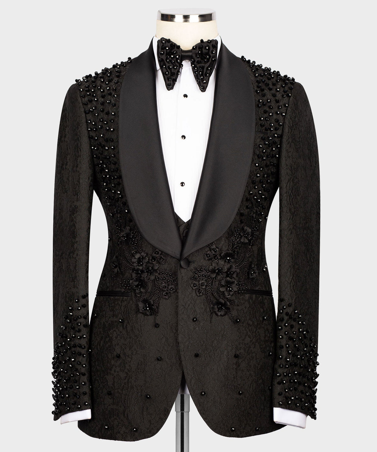 Black tuxedo blazer with satin lapels and bead embroidery on shoulders and chest