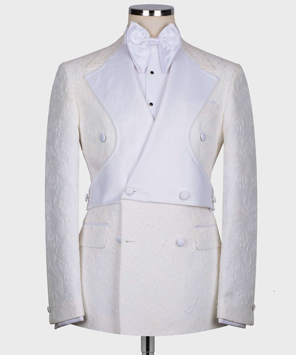 White double-breasted tuxedo jacket with bow neck shirt and matching trousers, front view