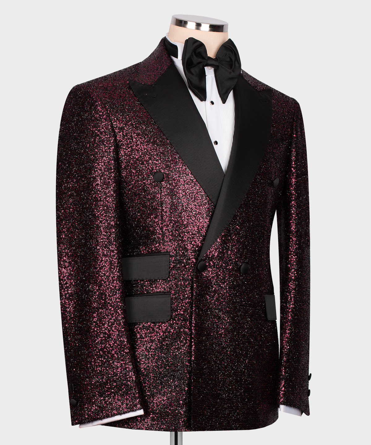 Men’s tuxedo jacket side view: dark pink sequin fabric, black vest panel, bow tie