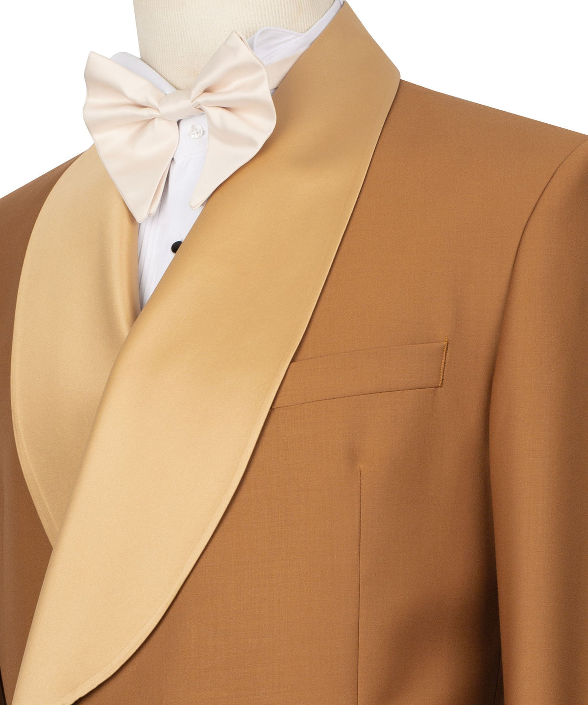 Close-up: cream bow tie with tuxedo shawl collar and lapel seam detail