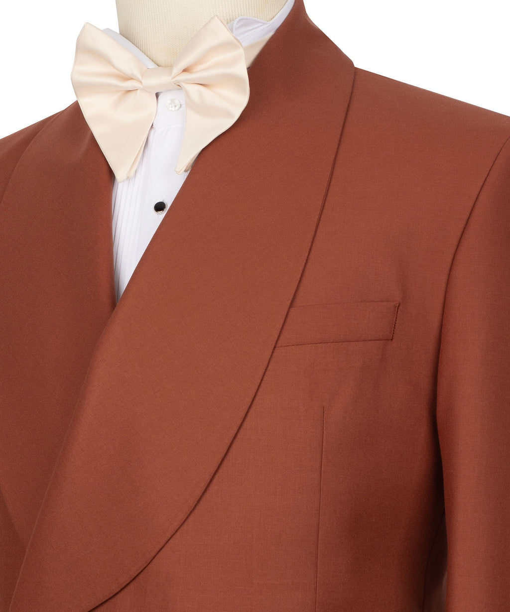 Close-up: brick tuxedo lapel with white dress shirt and cream bow tie