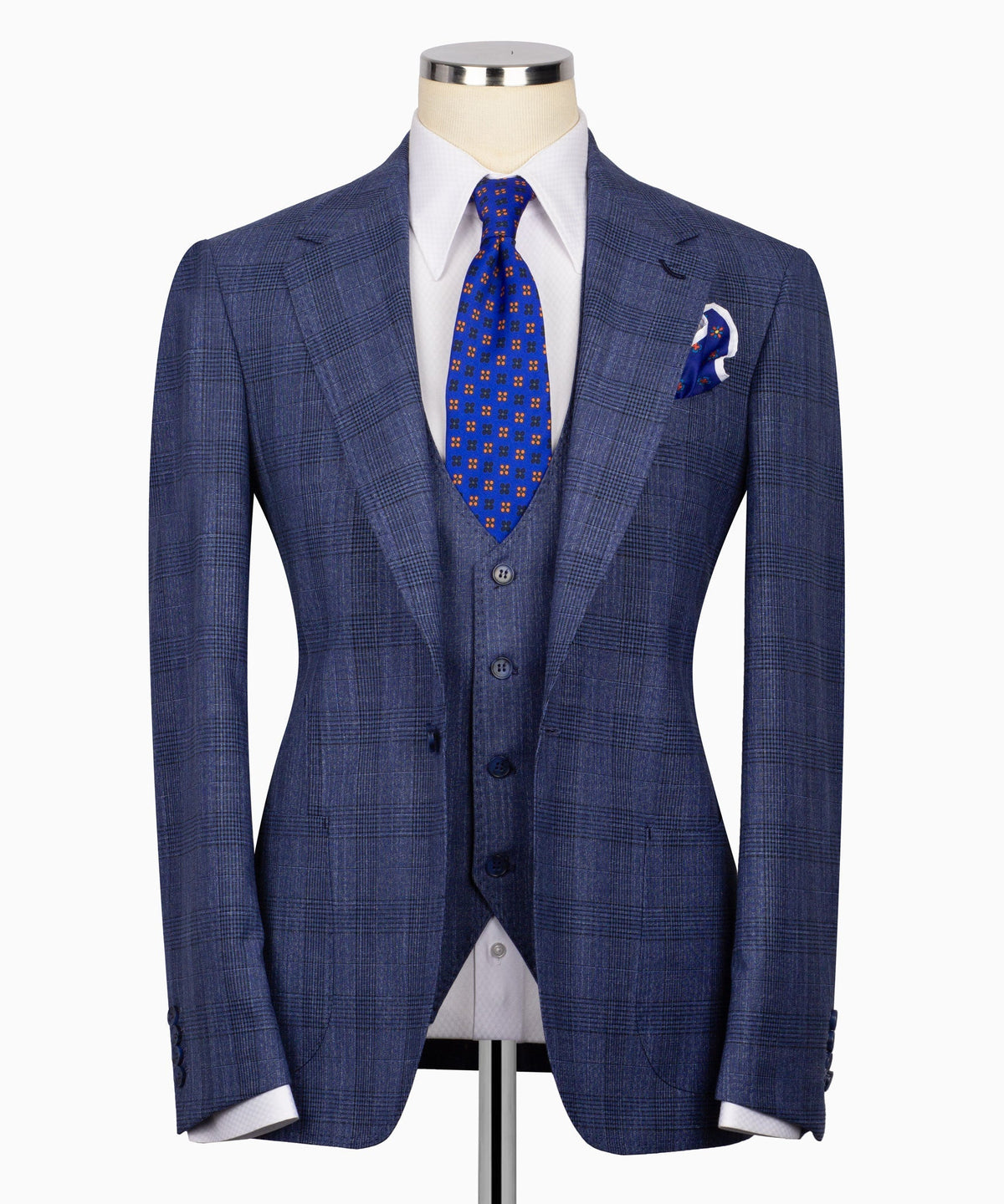 Blue plaid three-piece suit jacket with notched lapels, vest, patterned tie, and pocket square
