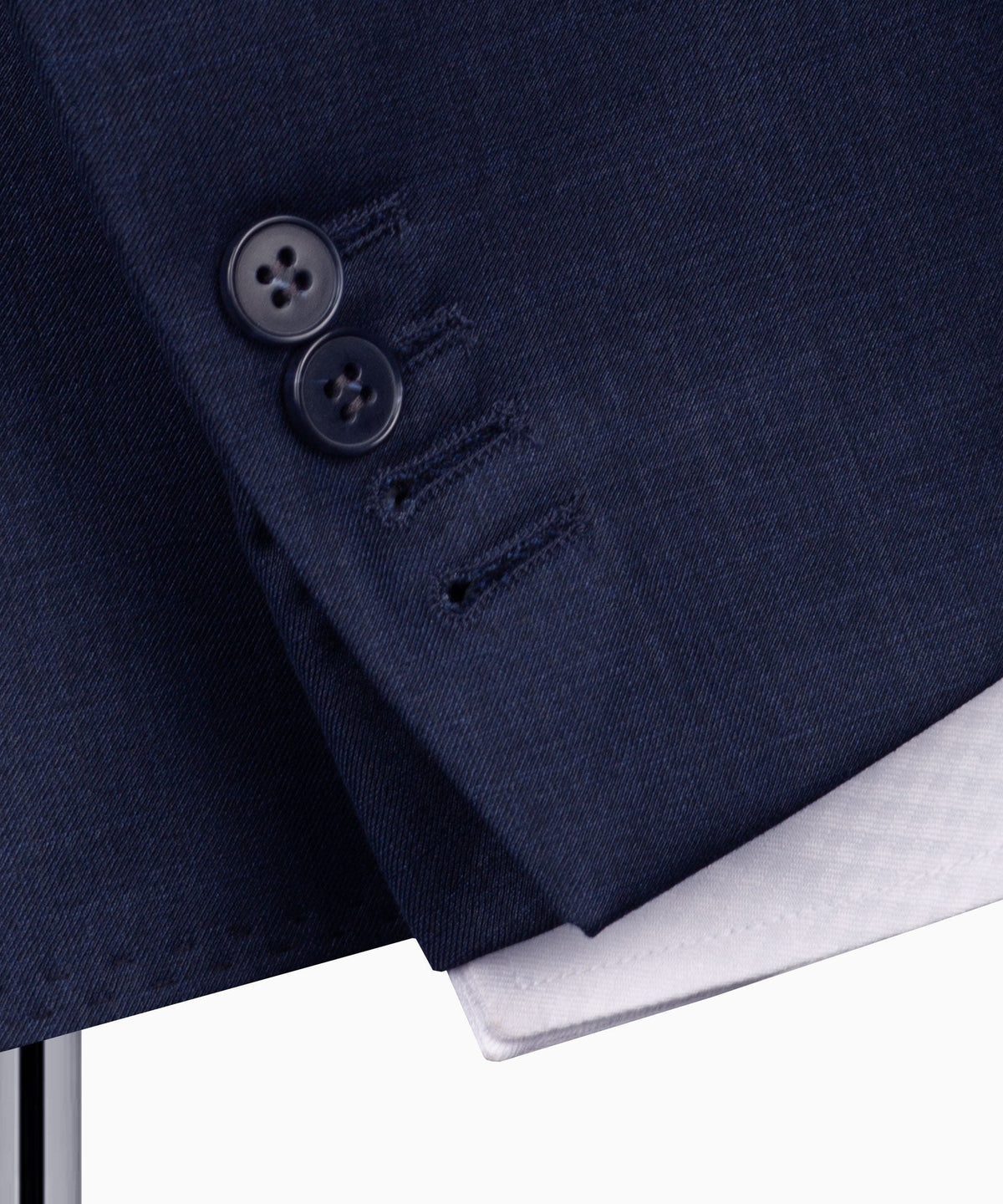 Navy plaid suit jacket close-up of buttons and lapel stitching