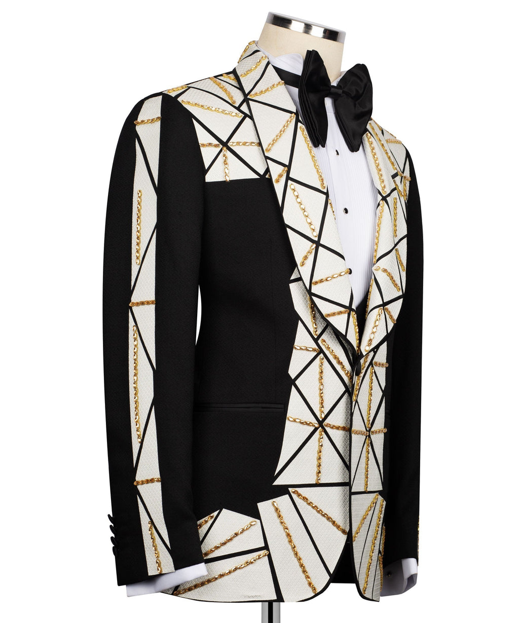 Black vest and tuxedo jacket with white geometric pattern and gold chain trim
