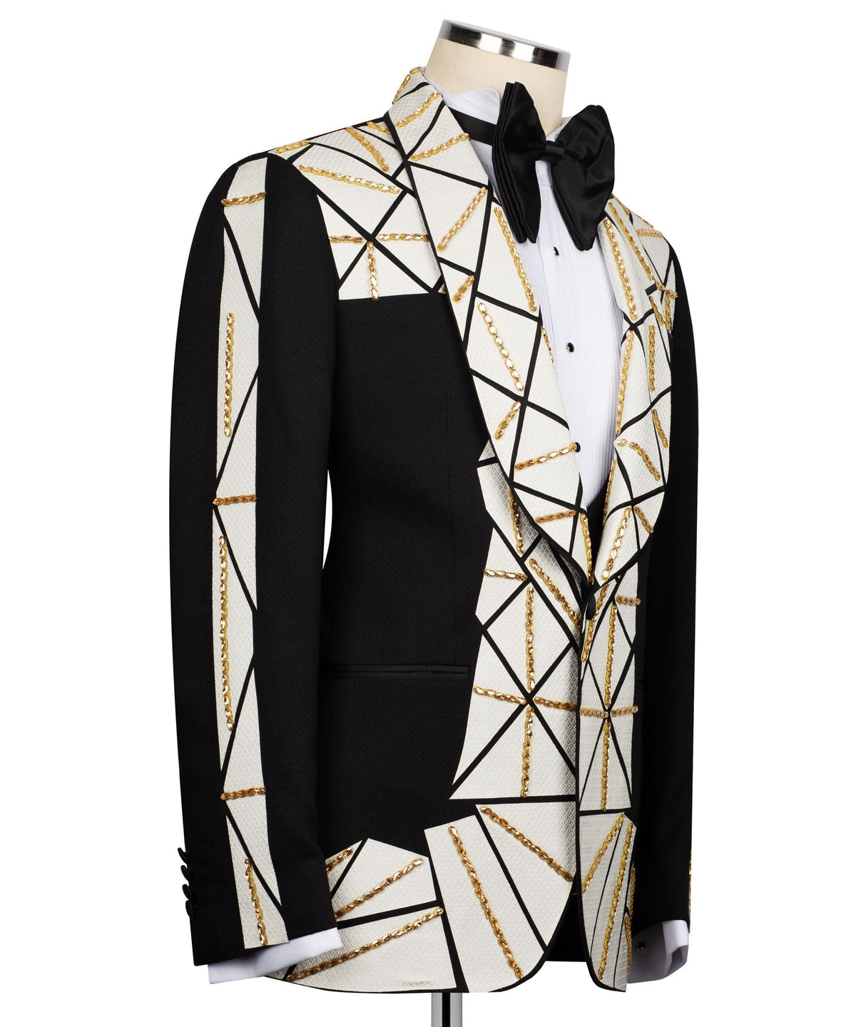 Black vest and tuxedo jacket with white geometric pattern and gold chain trim