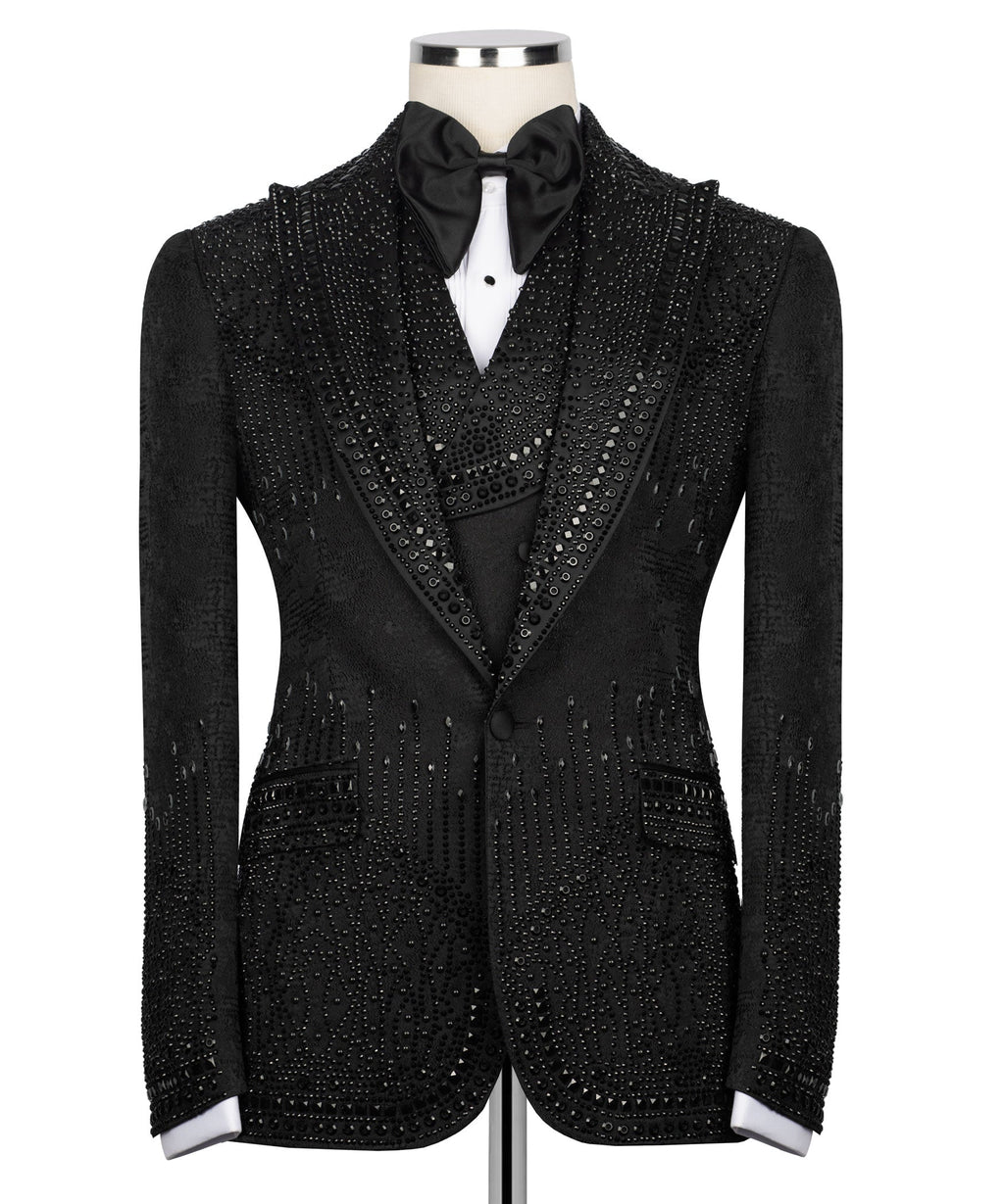Black embellished tuxedo jacket front view with bow tie and rhinestone-style buttons