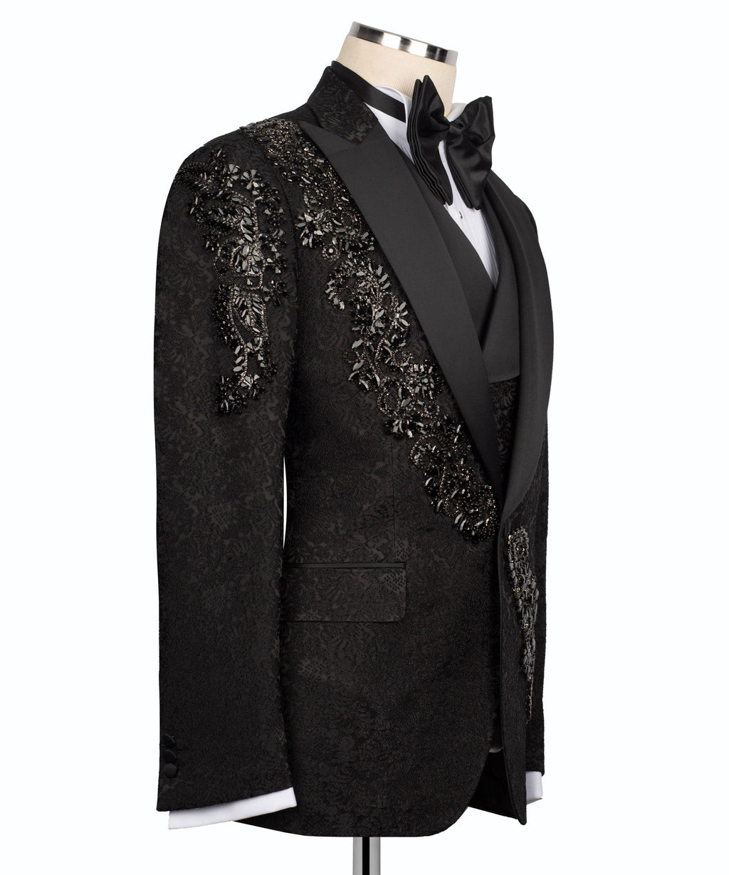 Black tuxedo suit jacket side view with sparkling stone embroidery along the sleeves